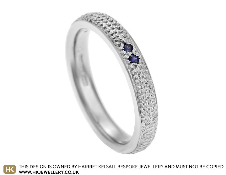 Alice's palladium and sapphire eternity ring with beading detail