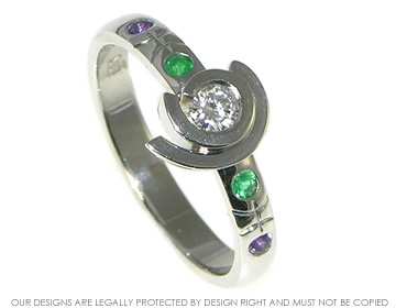 Initials inspired diamond, emerald and amethyst engagement ring