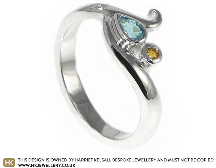 Sterling silver engagement ring with a pear shaped London blue topaz