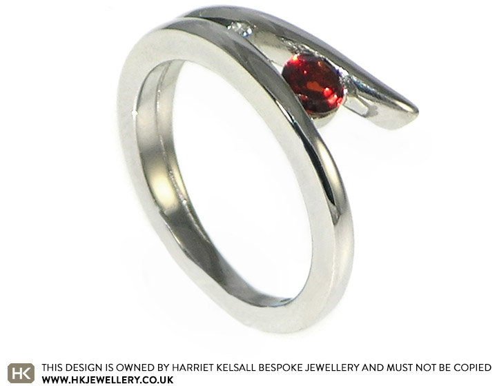 Emily's palladium engagement ring with a garnet and diamond