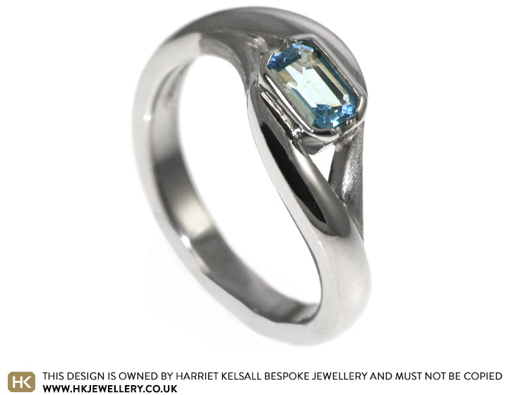 Sarah's emerald cut blue topaz engagement ring