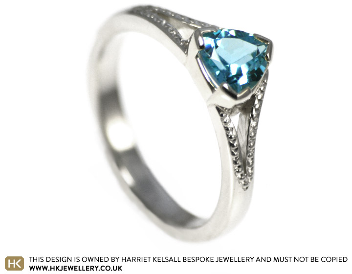 Freya's stunning trilliant cut blue topaz engagement ring