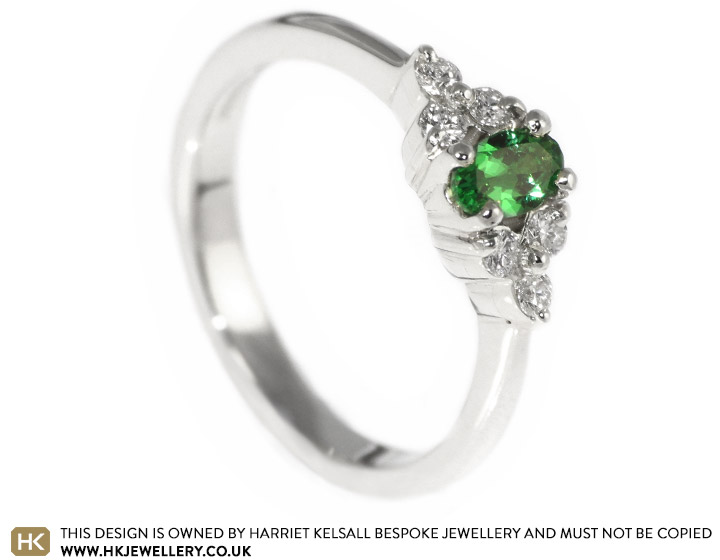 Lindsay's oval cut tsavorite and diamond engagement ring