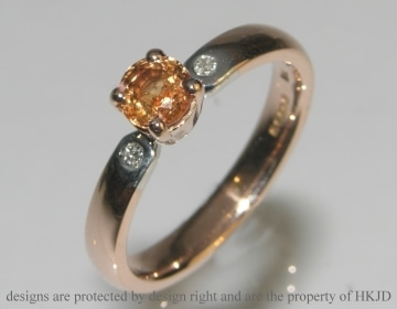 9ct white and rose gold engagement ring with a Mandarin garnet