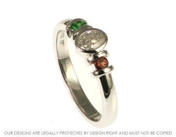 Bespoke 9ct white gold engagement ring with 0.36ct oval cut diamond with Tsavorite and garnet 