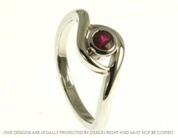 Wave inspired platinum and ruby twist style engagement ring