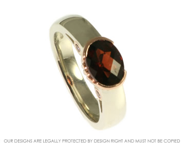 White and rose gold garnet and cognac diamonds engagement ring