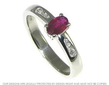 Bespoke platinum engagement ring with a ruby and diamonds