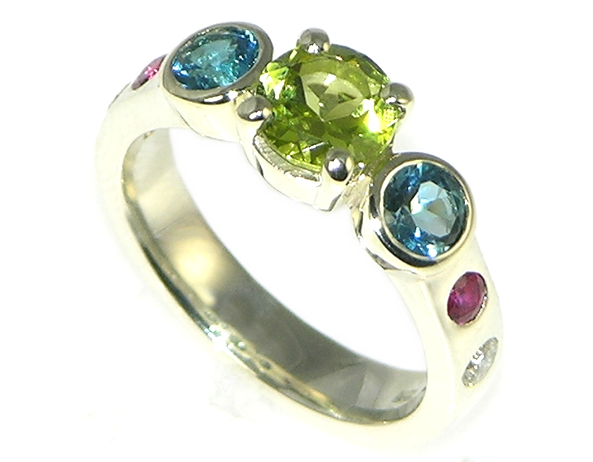 Rainbow inspired engagement ring with vibrant mixed gemstones