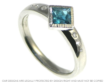 Bespoke palladium engagement ring with a London blue topaz and diamonds