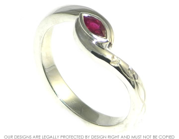 A poppy inspired marquise cut deep red ruby engagement ring. 