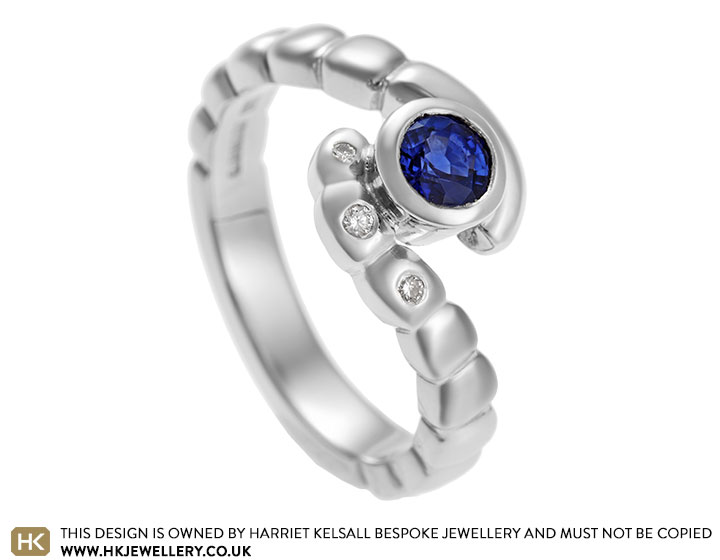 Bespoke palladium sapphire and diamond twist style engagement ring