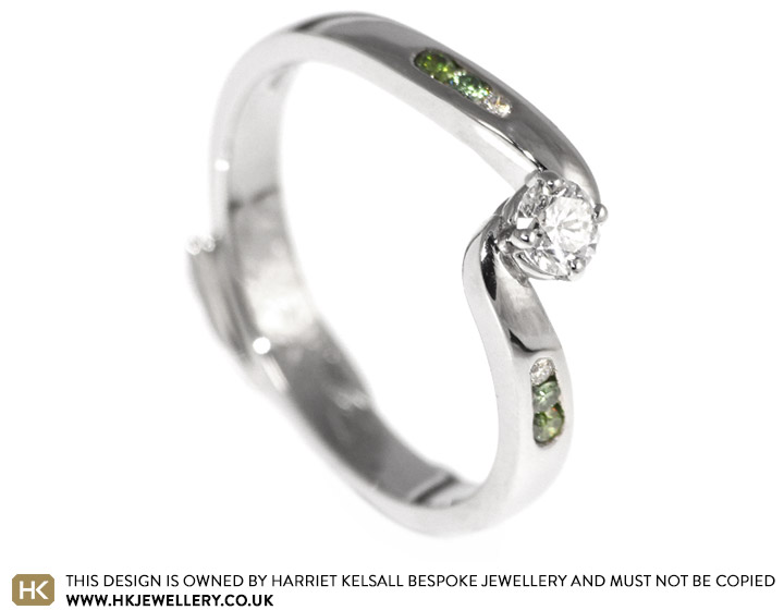 Carrie's palladium engagement ring with white and green diamonds