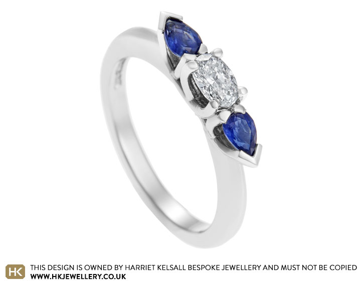 Palladium, 0.24ct oval cut diamond and 0.40ct pear cut sapphire engagement ring