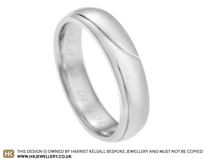 Alex's palladium wedding ring with engraved detail