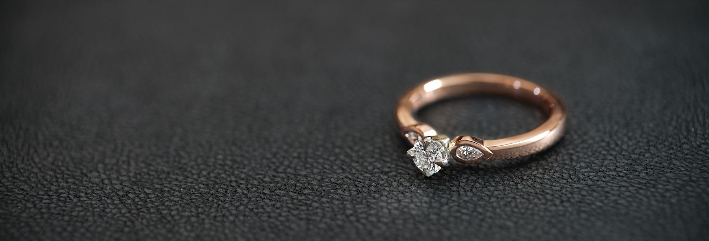 triology-style-engagement-ring-with-rose-gold-and-palladium