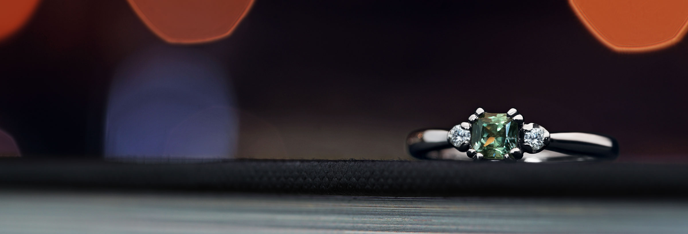 Green sapphire and diamond engagement ring