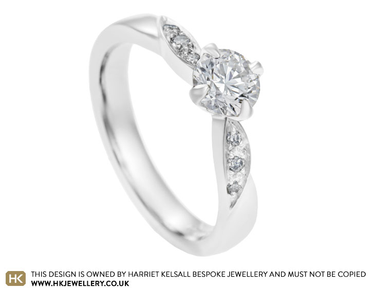 Platinum and 0.69ct diamond engagement ring with marquise shoulder detailing