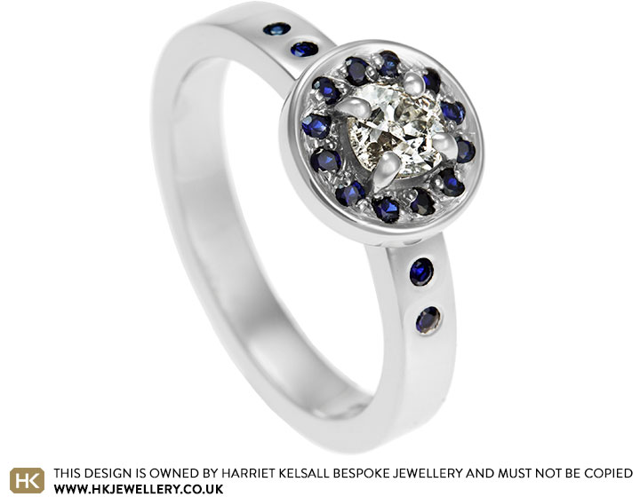 Laura's diamond and sapphire platinum halo dress ring