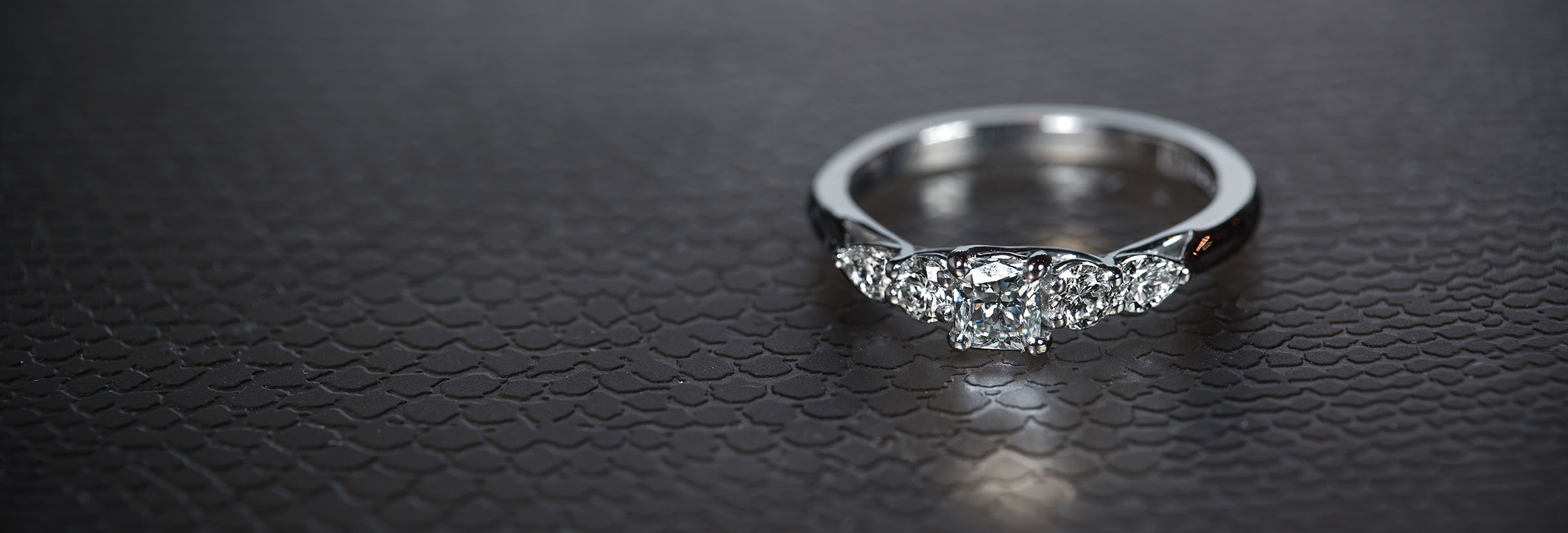 five-stone-engagement-ring-with-weaving-claw-design