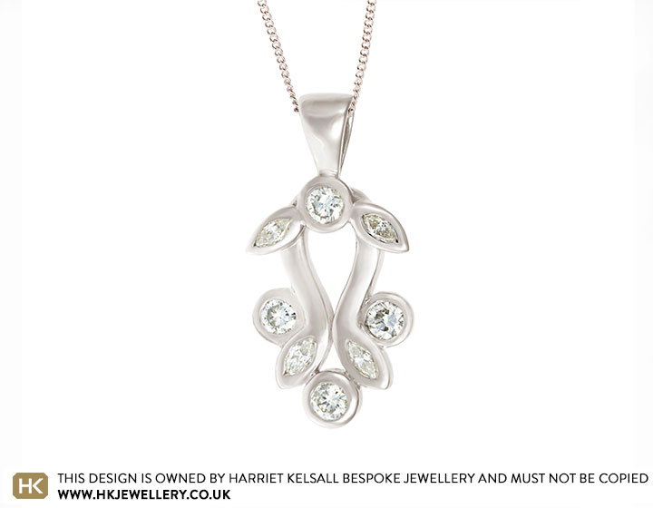 Maria's floral inspired pendant using family metal and diamonds