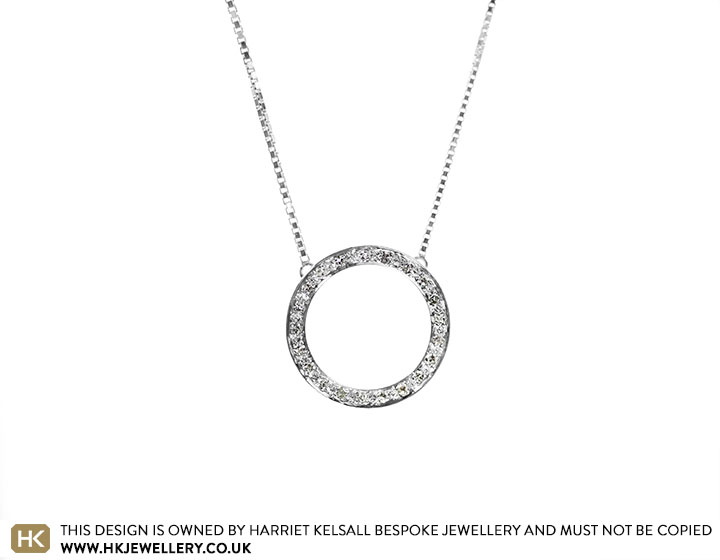 Victoria's elegant Sterling silver and diamond circle pendant