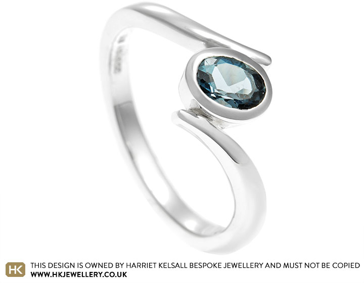 Charlotte's oval topaz and sterling silver engagement ring