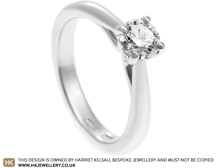 Binal's platinum and diamond engagement ring with heart side detailing