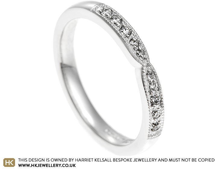 Platinum pinch eternity ring with round brilliant cut G-H VS1-2 diamonds totalling 0.12ct