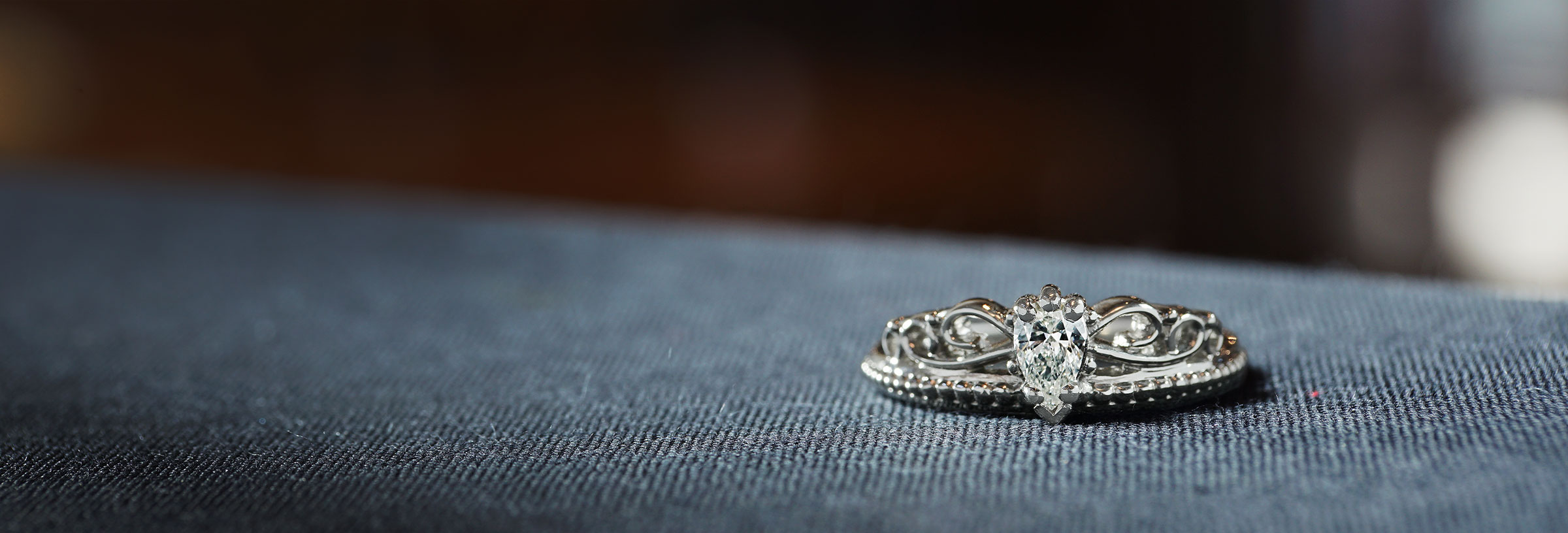 palladium-tiara-inspired-engagement-ring-with-pear-cut-diamond
