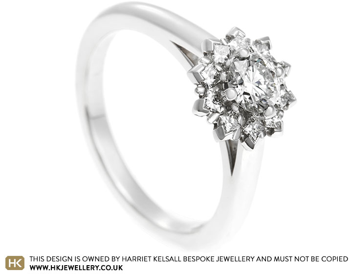 Palladium engagement ring with a halo of diamonds totalling 0.56ct