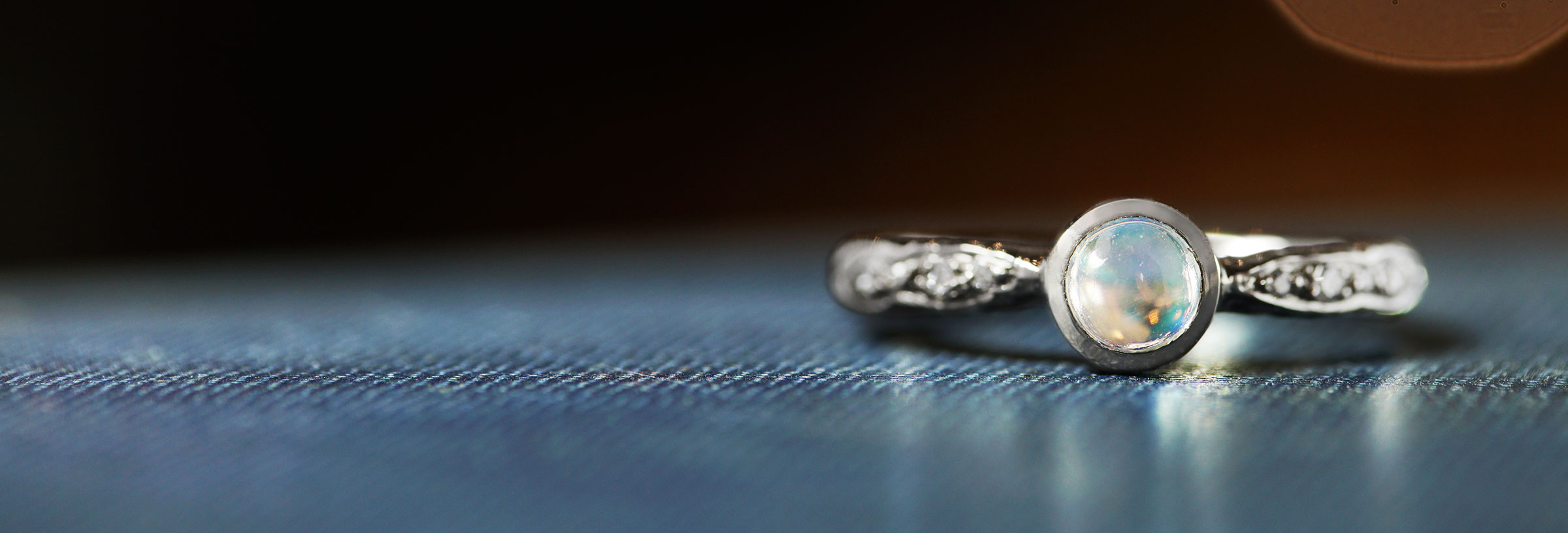 palladium-engagement-ring-with-moonstone-and-diamonds