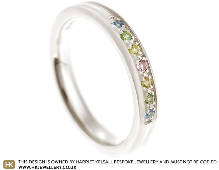 Fairtrade 9 carat white gold eternity ring with multi-coloured sapphires totalling 0.07ct