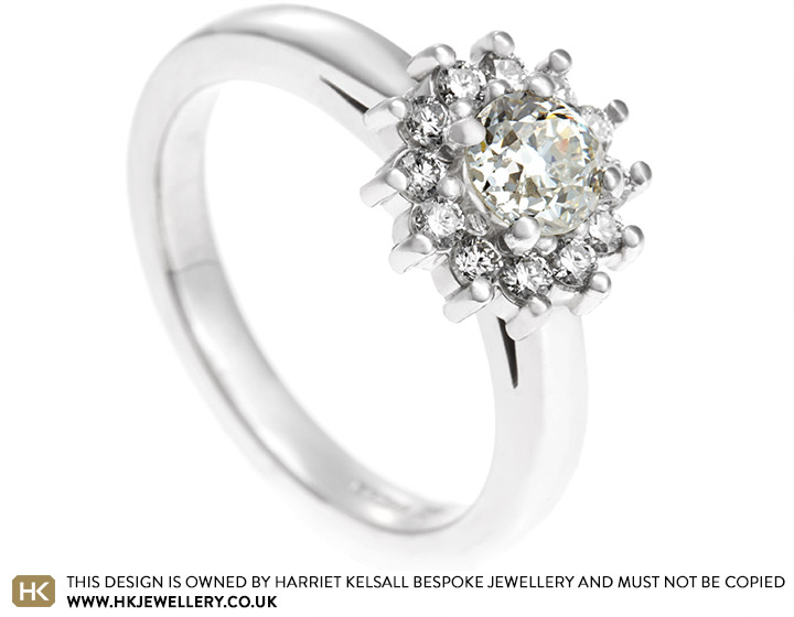 Victoria's Platinum Cluster Engagement Ring with Inherited Central Diamond