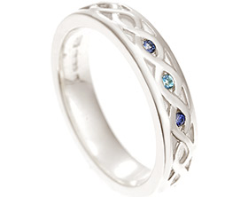 18069-white-gold-wedding-ring-with-celtic-relief-engraving-and-sapphires-and-aquamarine_1.jpg