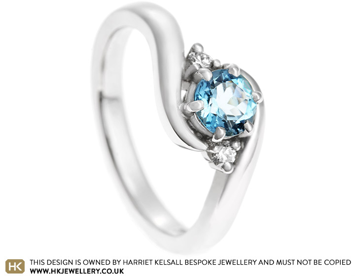 Kara's aquamarine and diamond trilogy style engagement ring