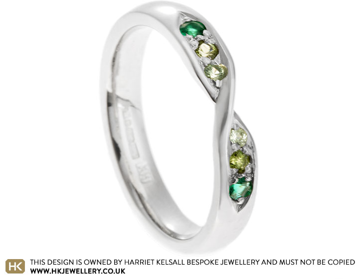 Renu's emerald, tourmaline and sapphire mobius twist eternity ring