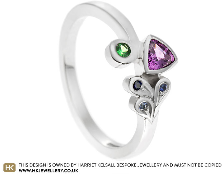 Lucy's colourful trilliant cut sapphire and peridot engagement ring