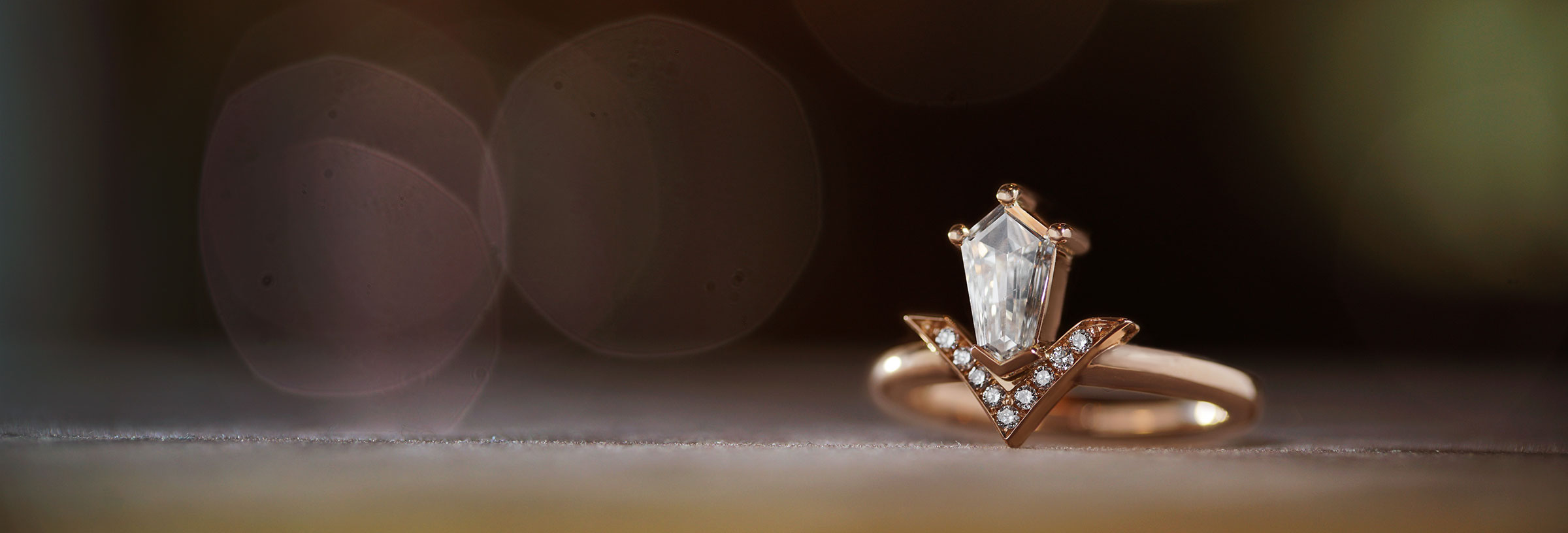 18-carat-rose-gold-engagement-ring-with-shield-cut-diamond