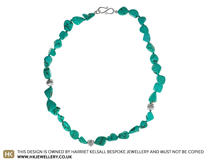 Turquoise and silver plated bead asymmetrical necklace