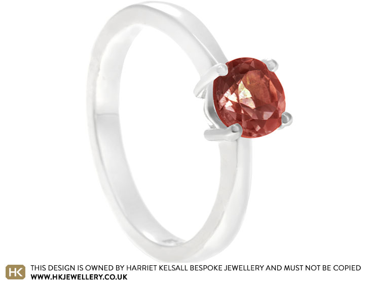 Fairtrade sterling silver dress ring with round cut garnet