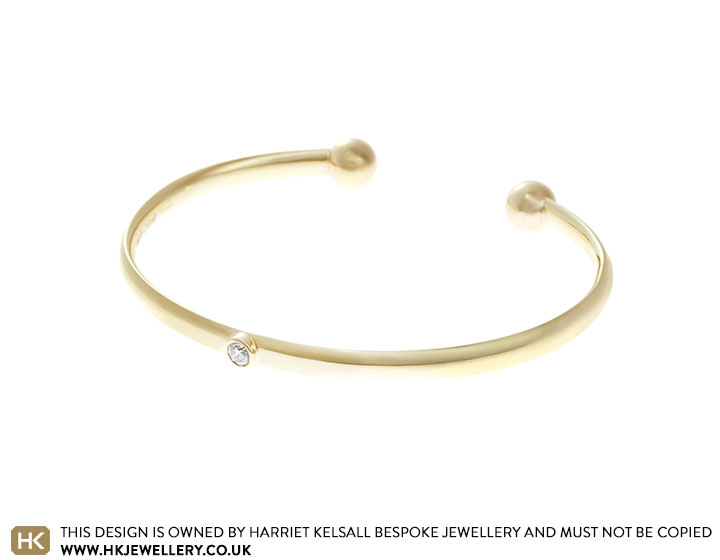 Helen's 9 carat yellow gold and diamond torque bangle