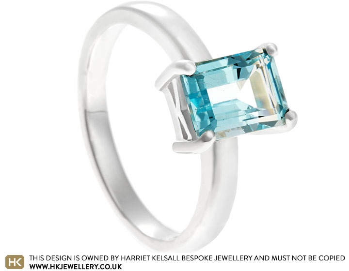 Fairtrade sterling silver dress ring with emerald cut topaz