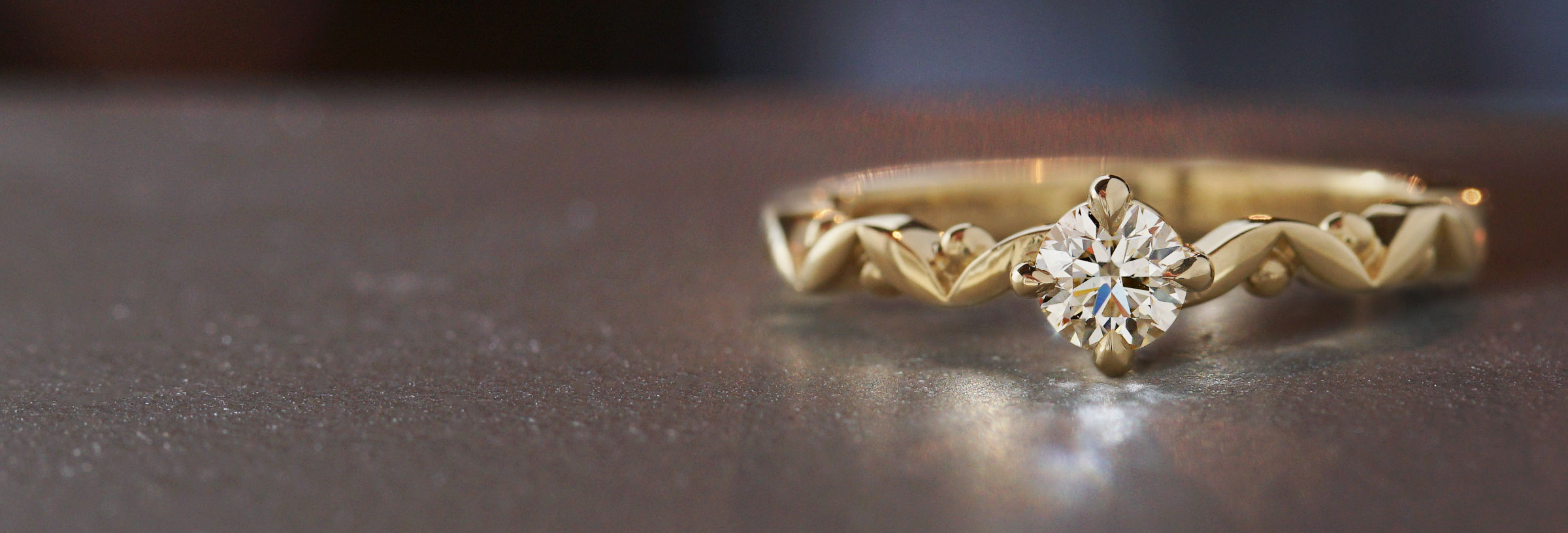 yellow-gold-diamond-engagement-ring-with-marquise-and-sphere-shaped-band