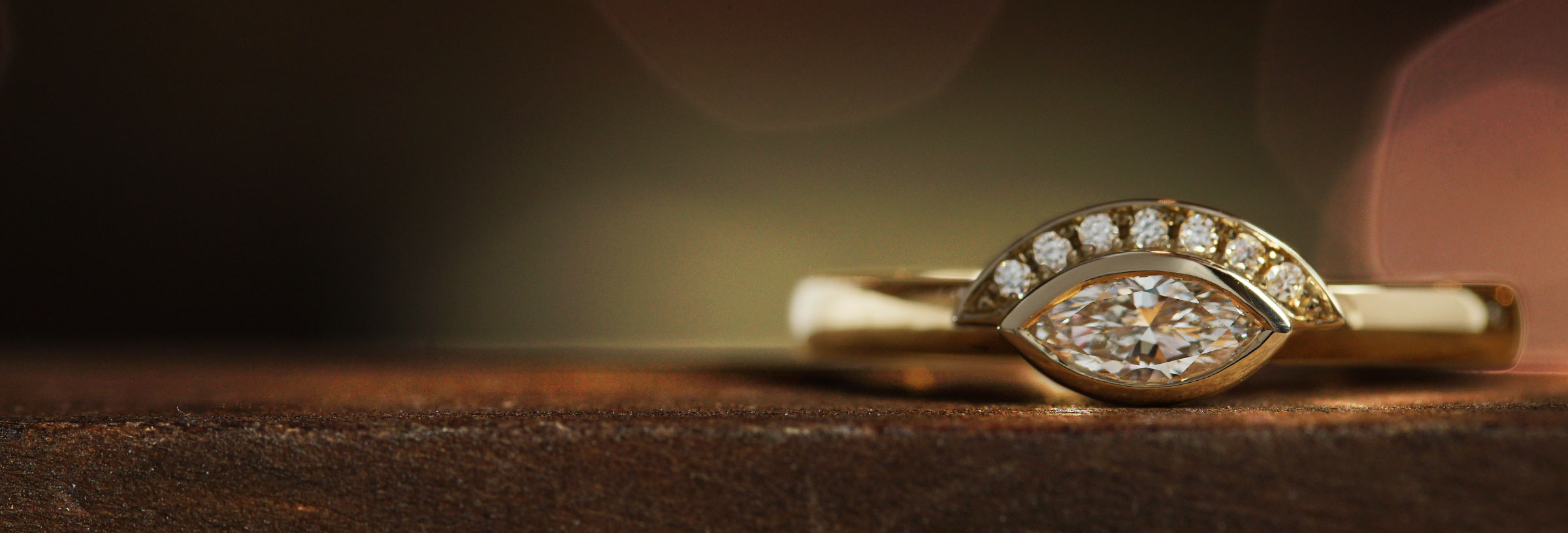 yellow-gold-marquise-cut-diamond-engagement-ring-with-half-halo