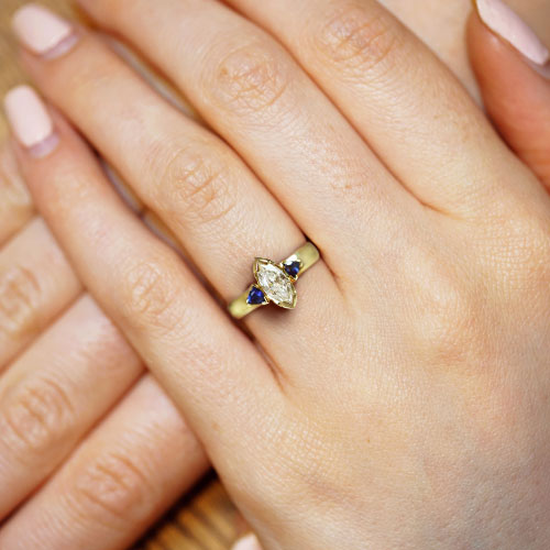 18299-yellow-gold-marquise-diamond-and-trilliant-sapphire-trilogy-engagement-ring_5.jpg
