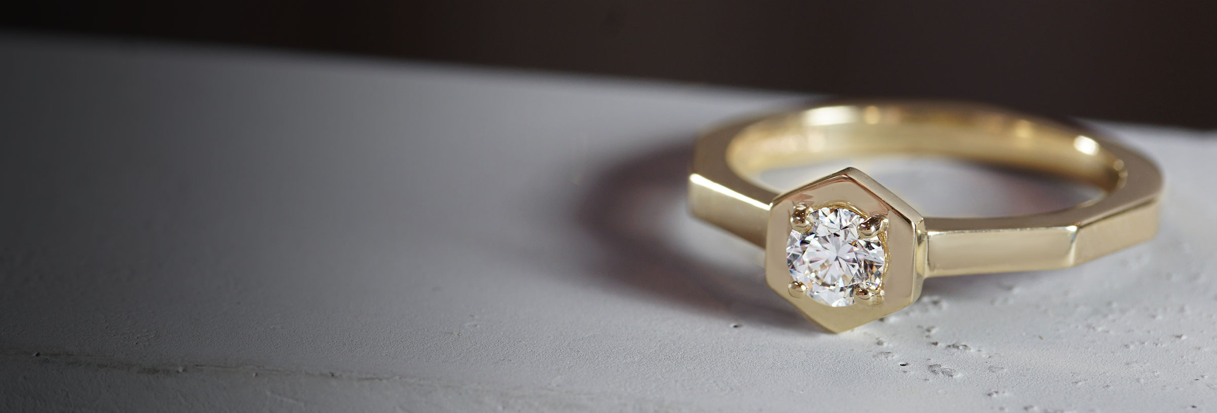 yellow-gold-hexagonal-engagement-ring-with-hexagonal-set-diamond