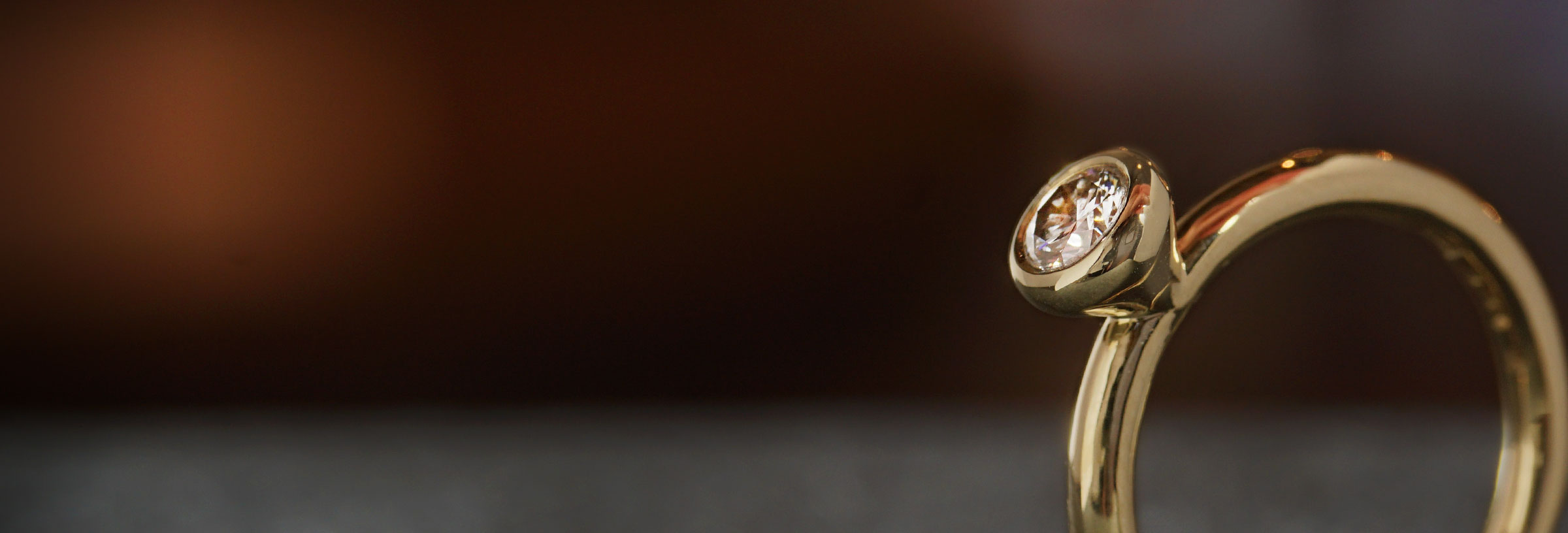 yellow-gold-all-around-set-diamond-solitaire-engagement-ring