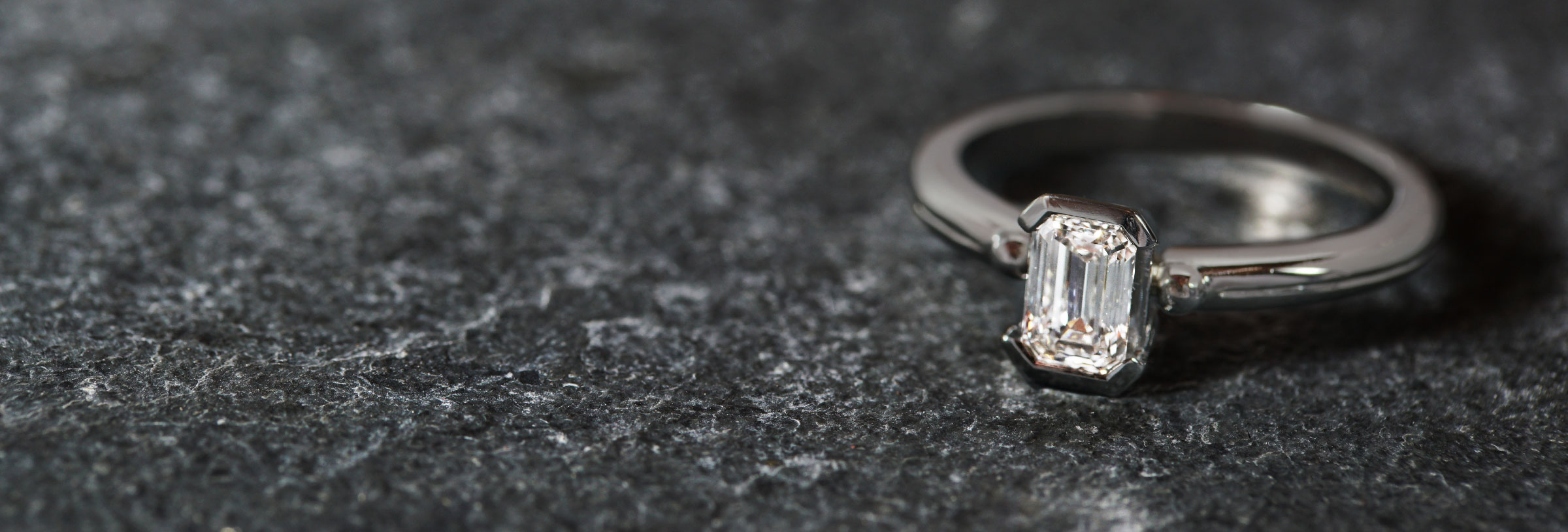 platinum-solitaire-emerald-cut-diamond-engagement-ring