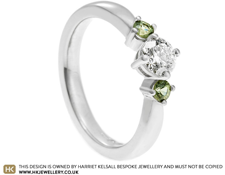 Maria's platinum diamond and green sapphire engagement ring